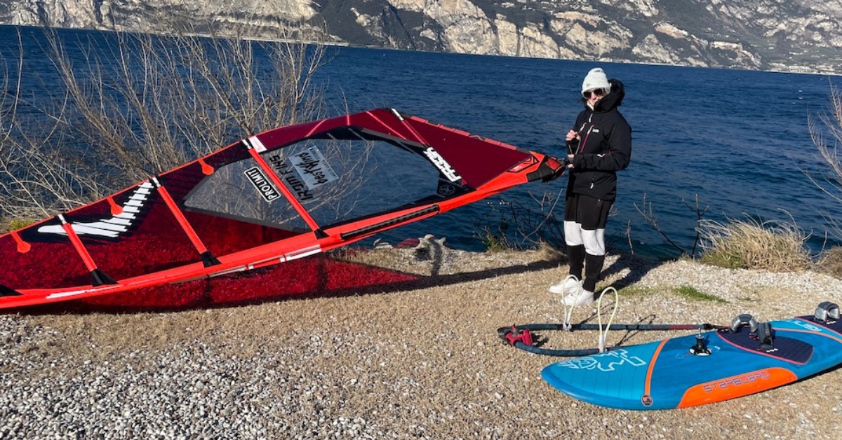 Windsurf sail and board at the lake